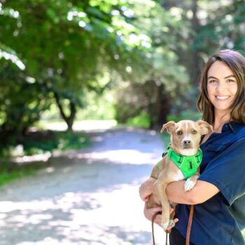 Bailey H Eagan, PhD, MSC, Director of Research, ASPCA, with small brown dog
